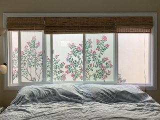 painted bougainvillea flowers on a wall outside a bedroom